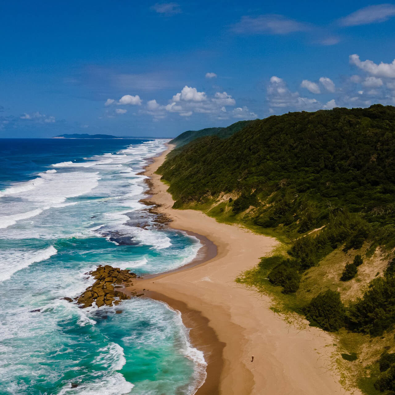 StLuciaSouthAfricasandoceanbluecoastalskylineatMissionRocksbeachnearCapeVidalinIsimangalisoWetlandParkinZululand-edited